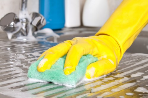 Detail-focused cleaner refreshing a commercial space in Sutton